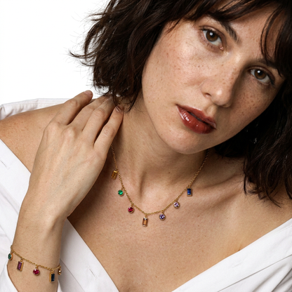 Rainbow CZ Charm Necklace and Bracelet - colorful zirconia charms worn together, model looking away